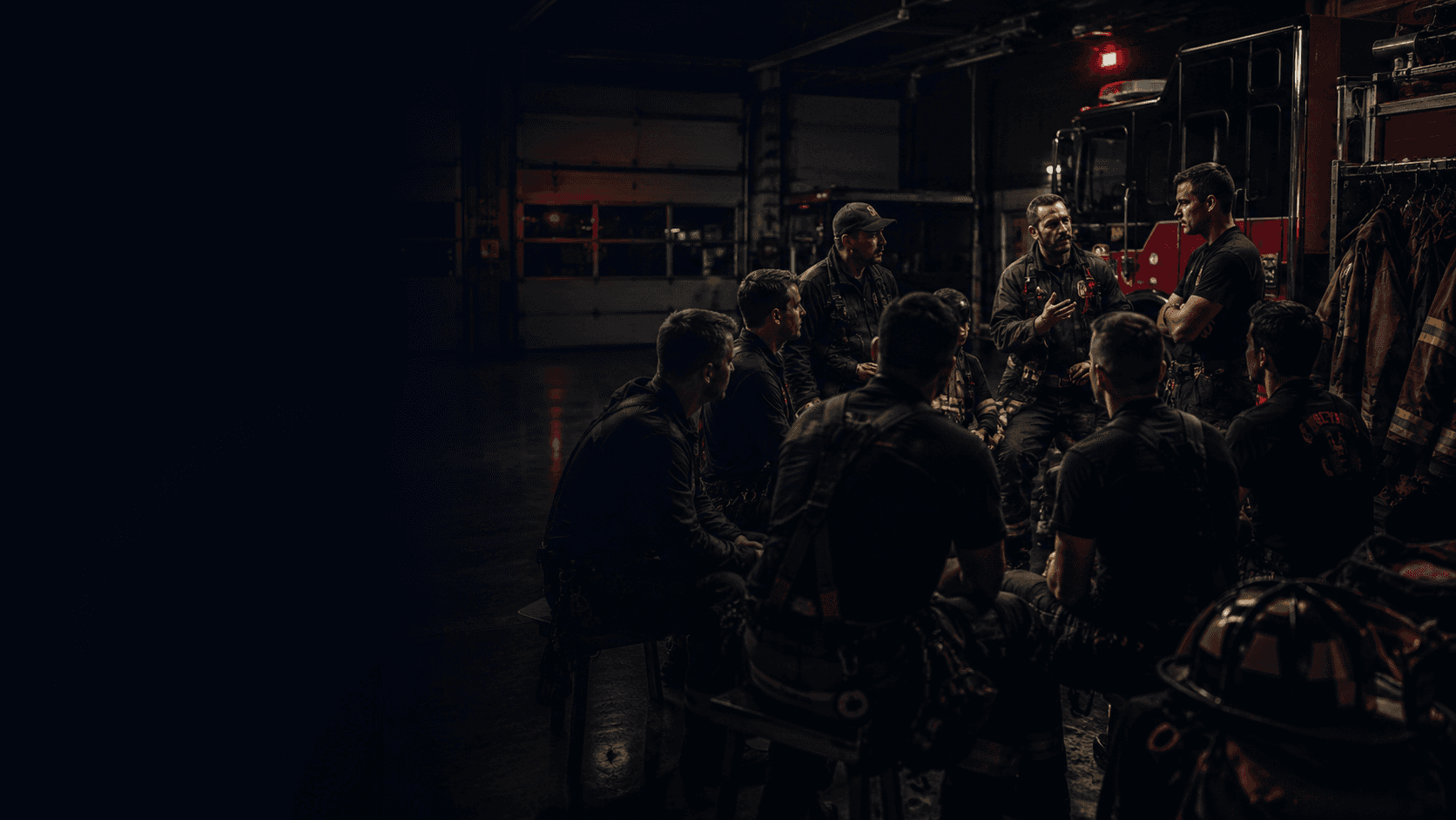 Fire personnel gathered in a briefing room